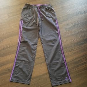 Adidas gray and purple workout pants with pockets.